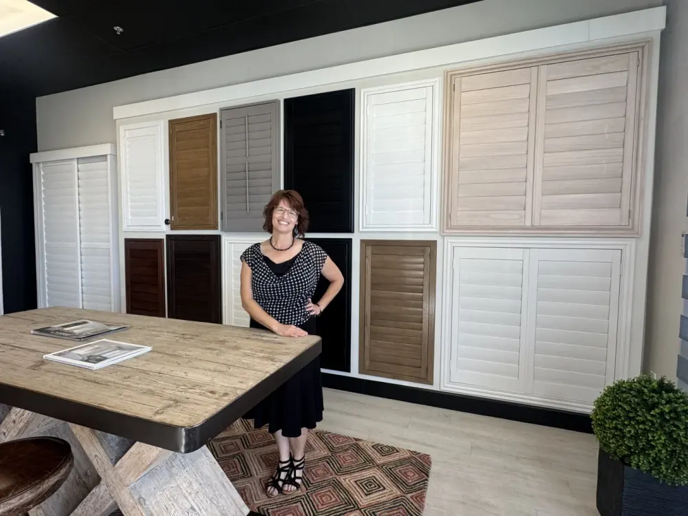 Laura from Southwest Blinds in the Peoria, AZ showroom's shutter section