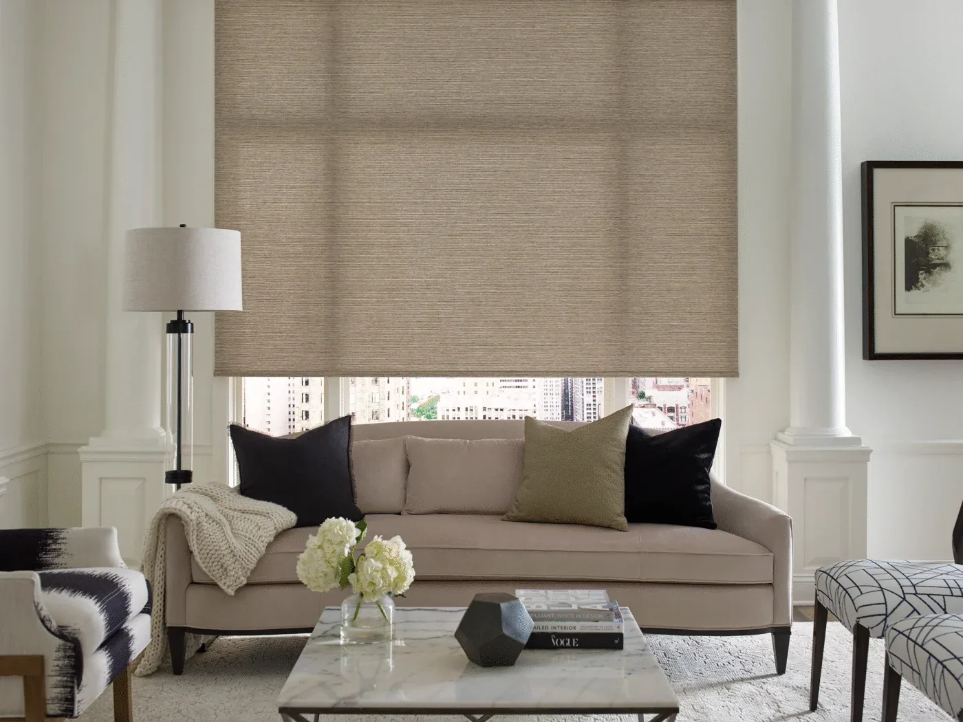 Motorized roller shades on a floor-to-ceiling window