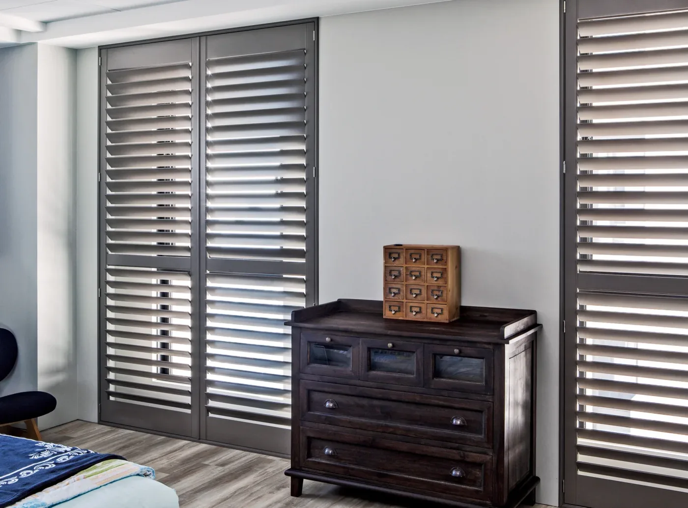 Close-up of a wood shutter louver and hidden tilt rod