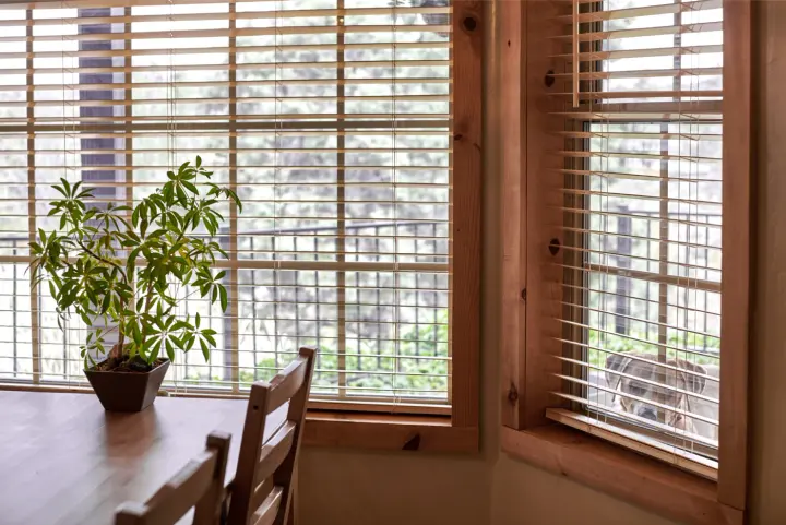 Wood blinds over windows in Chandler kitchen installed by Southwest Blinds & Shutters