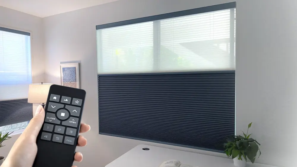 Large window with big dark motorized shades on it