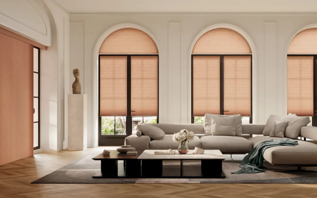 Rose-colored window shades on arched windows in a Maricopa County home.