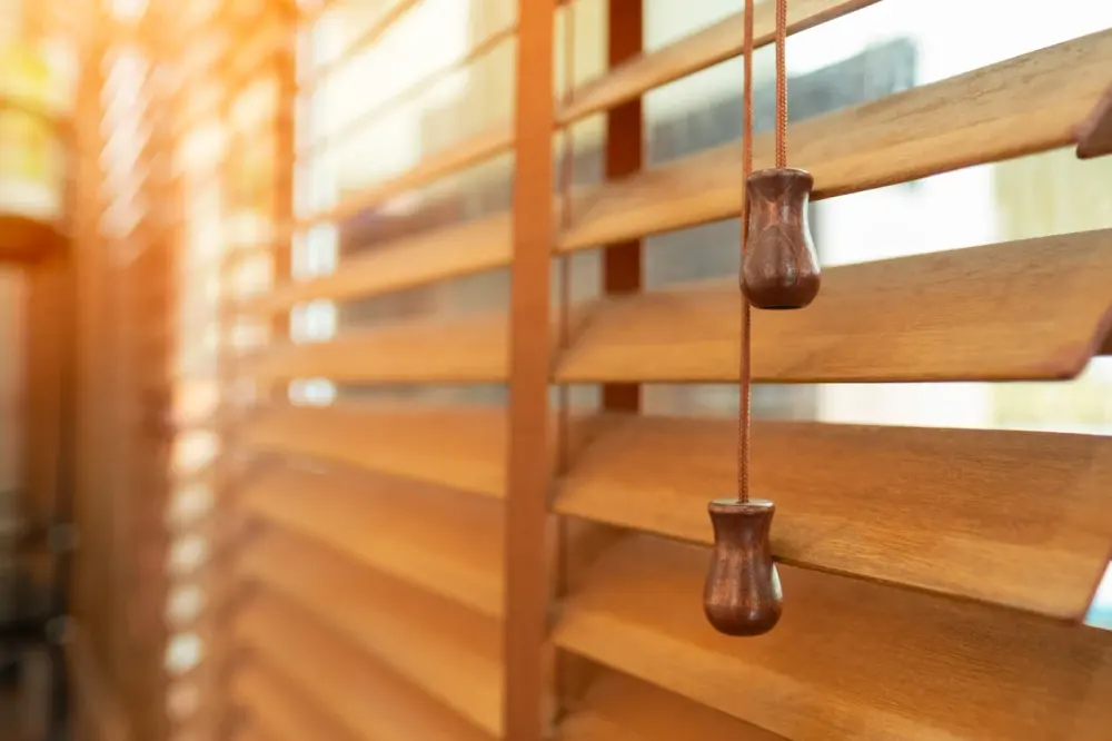 Close up view of wood stained window blinds