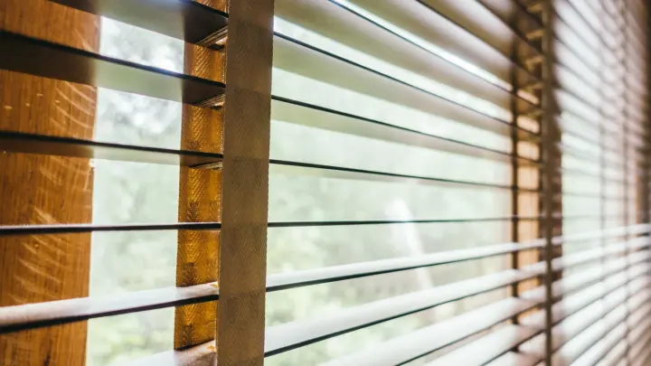 Closeup of open wood blinds