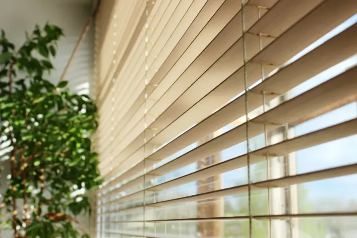 Wood blinds over windows in Whitney home installed by Southwest Blinds & Shutters