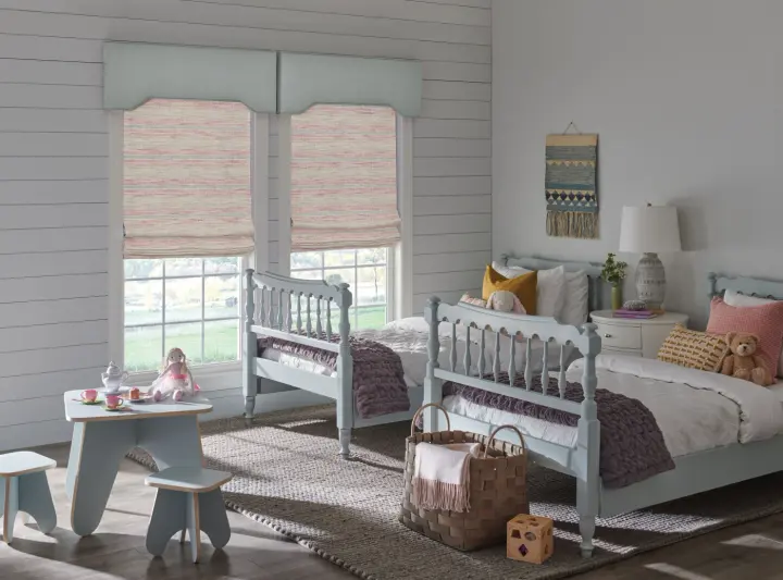 Close-up of gray Roman shades.