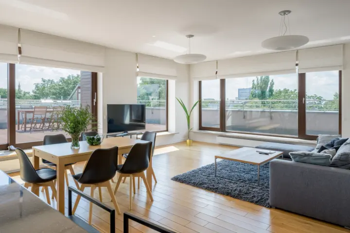 Spacious living room in Las Vegas living room with shades on windows | Southwest Blinds and Shutters