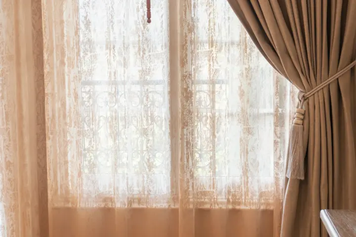 Lacy drapery over a window in a Gilbert, AZ home.