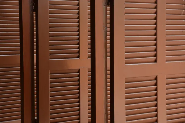 Close view of brown door shutters in home