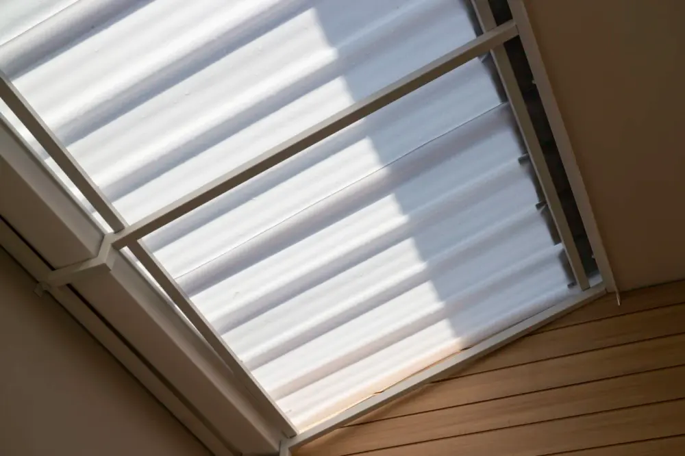Motorized shades covering a large skylight
