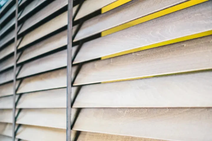 Close-up view of wood shutters installed inside a home