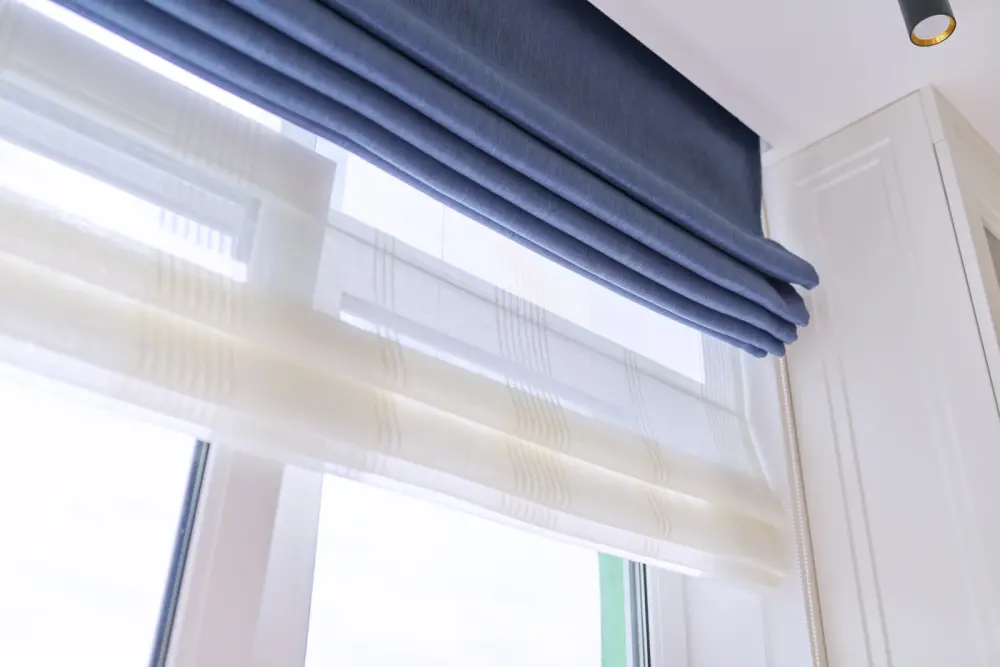 Close up of blue and white Roman blinds