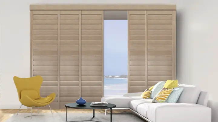 Wooden window shutters on windows in a minimalist home living room