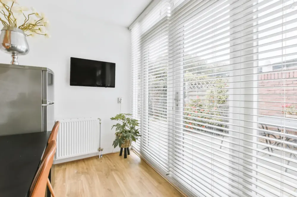 White blinds over sliding glass doors in Arizona home