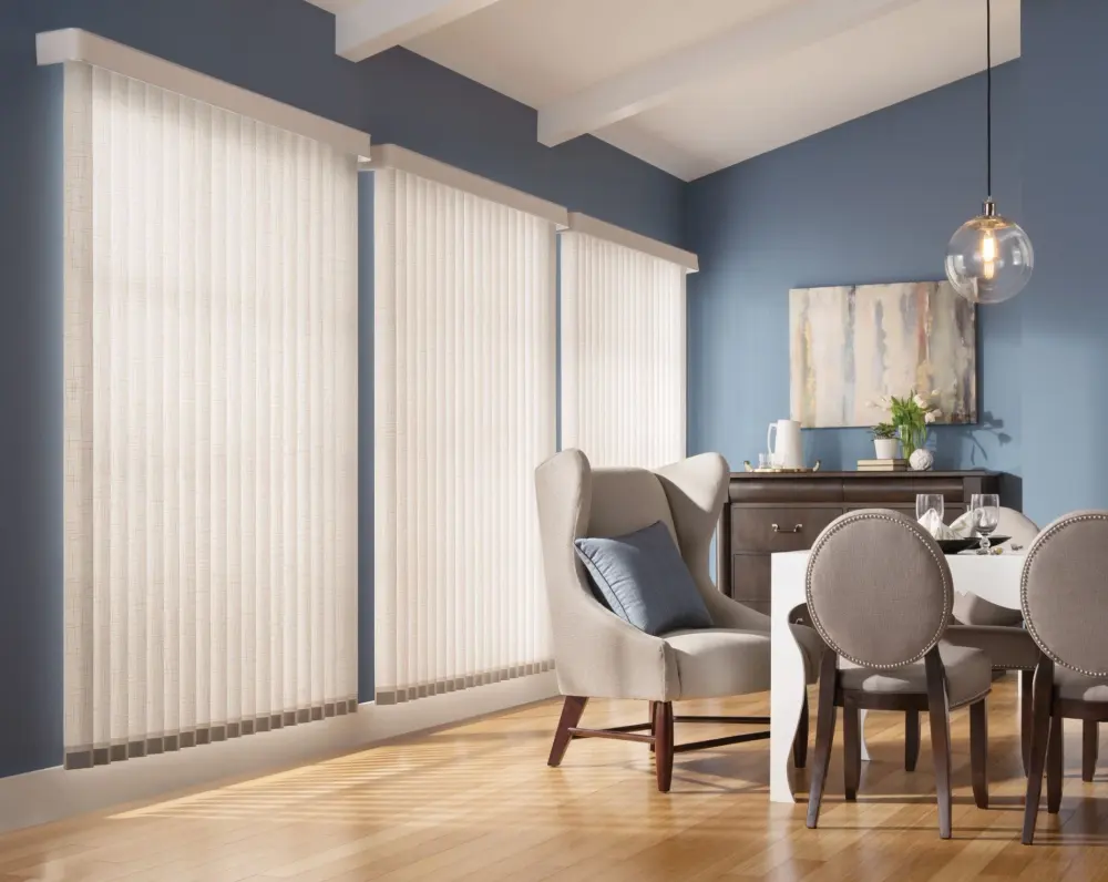 Elegant dining room featuring custom vertical blinds across large windows.