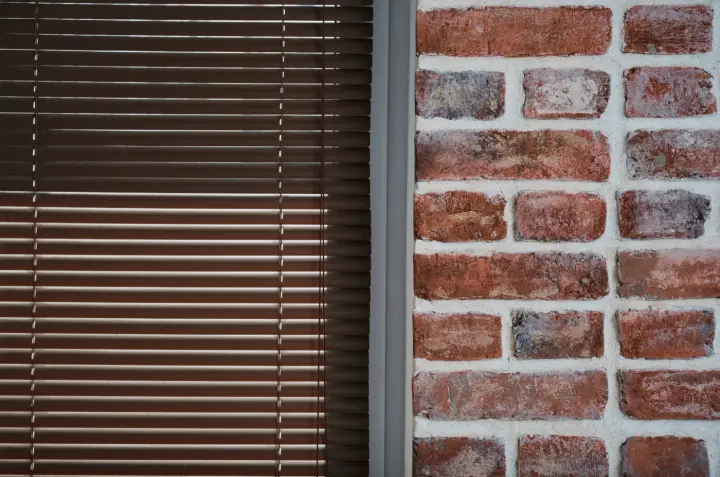 Closeup of mini blinds over window in Las Vegas home | Southwest Blinds and Shutters