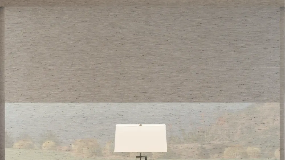 A textured beige roller window shade is partly lowered, softly filtering outdoor light above a modern table lamp silhouette.