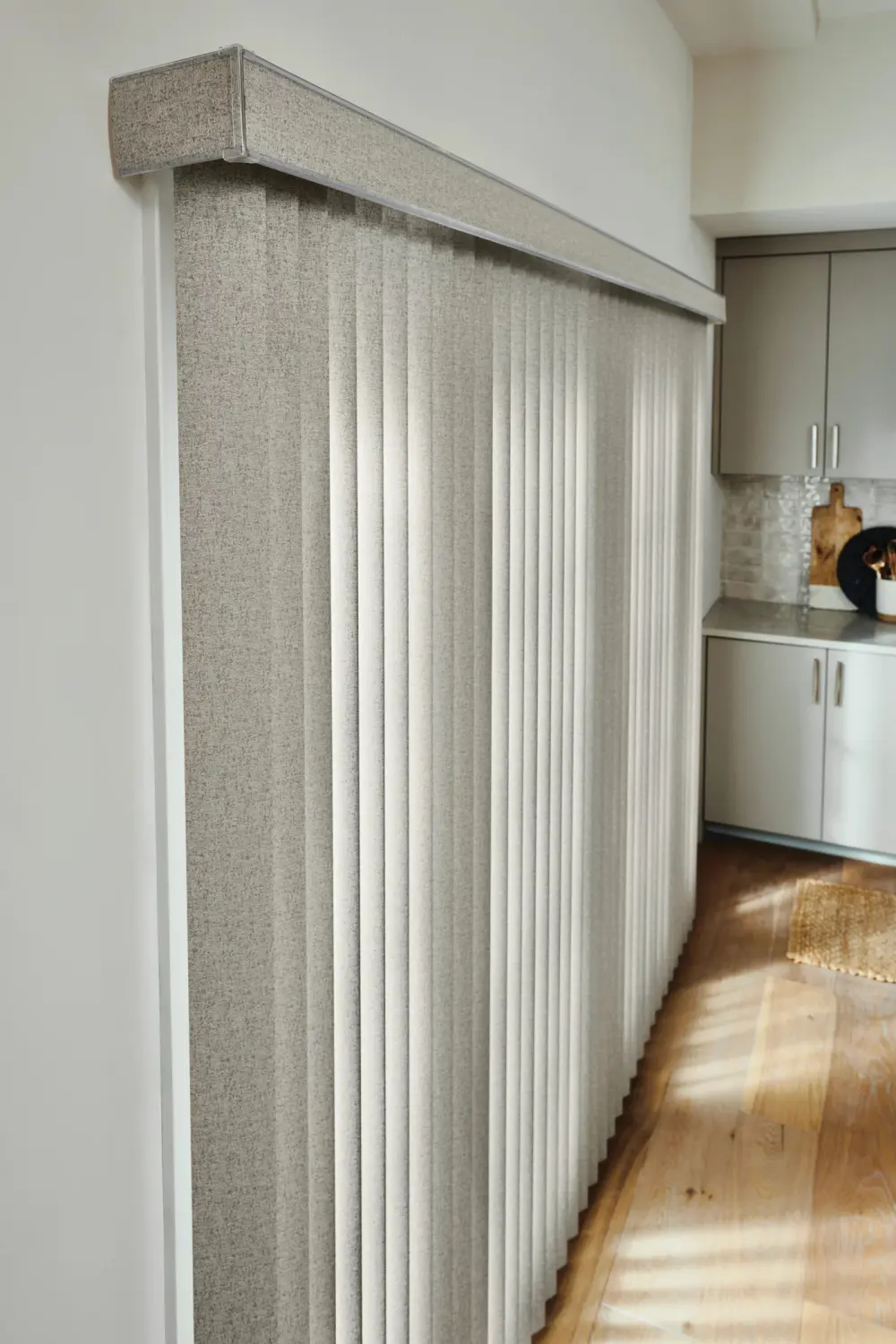 Close-up of gray vertical blinds.