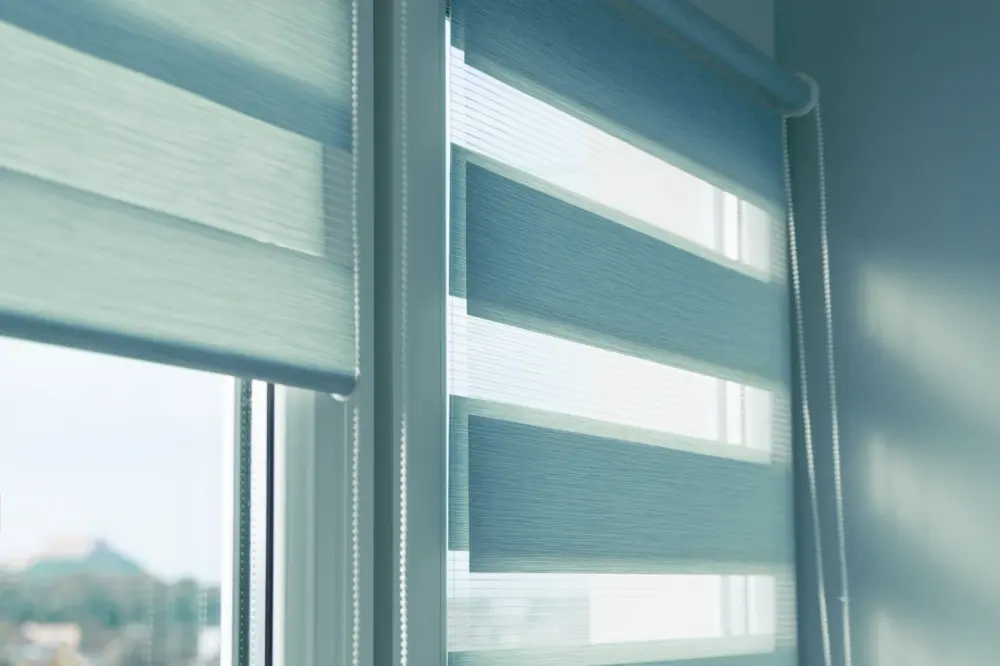 Blue and white zebra shades over a window in a Henderson, NV home.