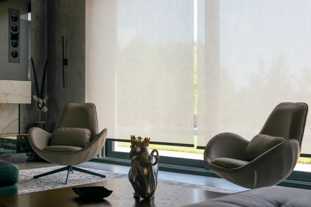 A modern home office space with automatic window shades.
