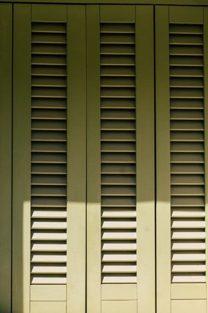 A closeup of green shutters in a Peoria, AZ home.
