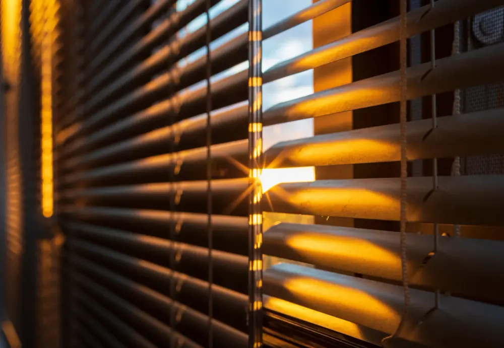Close-up of premium blinds with the sun filtering through