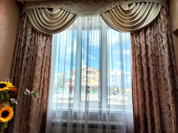 Stunning custom drapes and drapery layered in a hallway