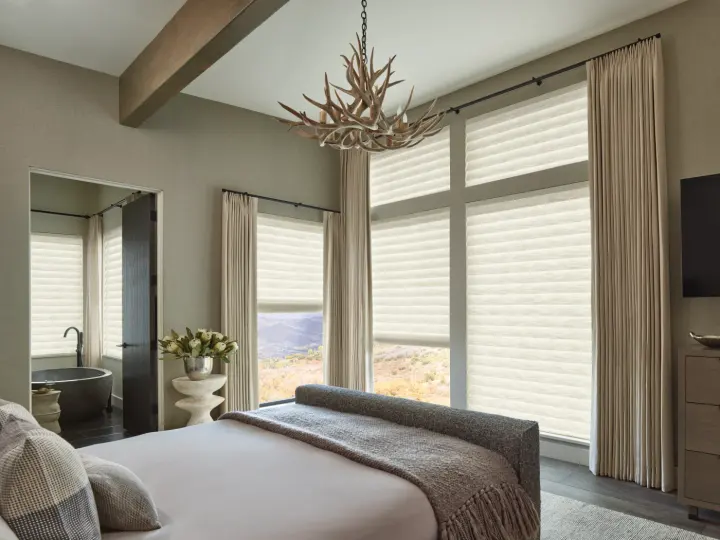 Roman shades over windows in a bedroom in Surprise, AZ.