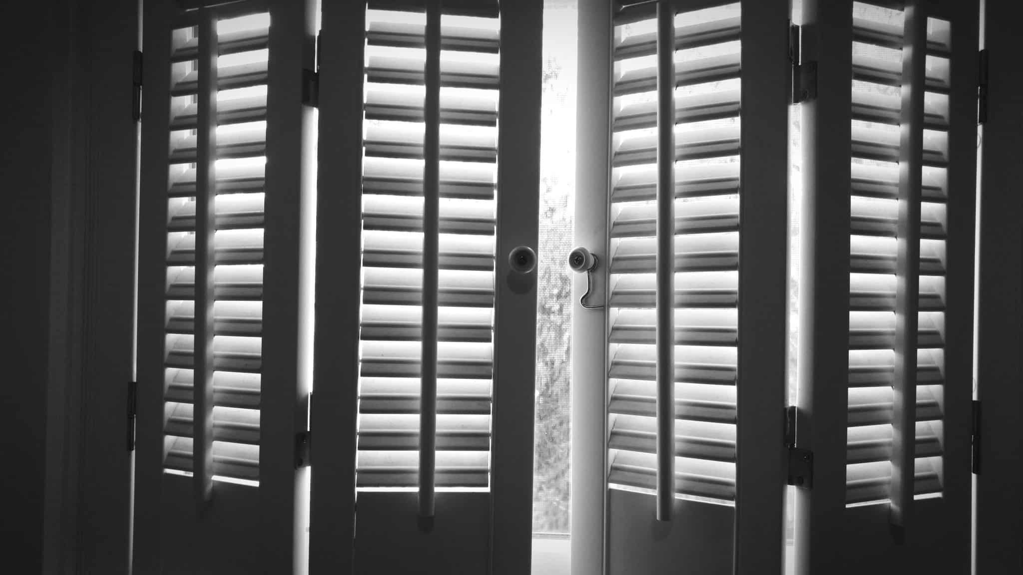 Closeup Of Shutters Partially Closed Over A Window