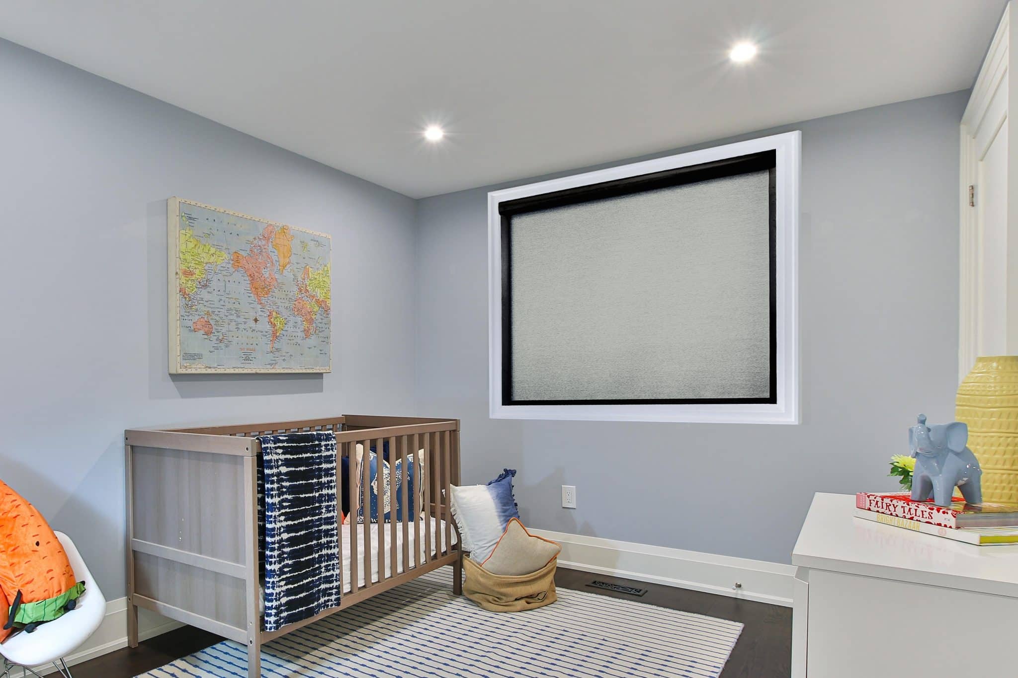 This Image Features A Nursery With Roller Window Shades.