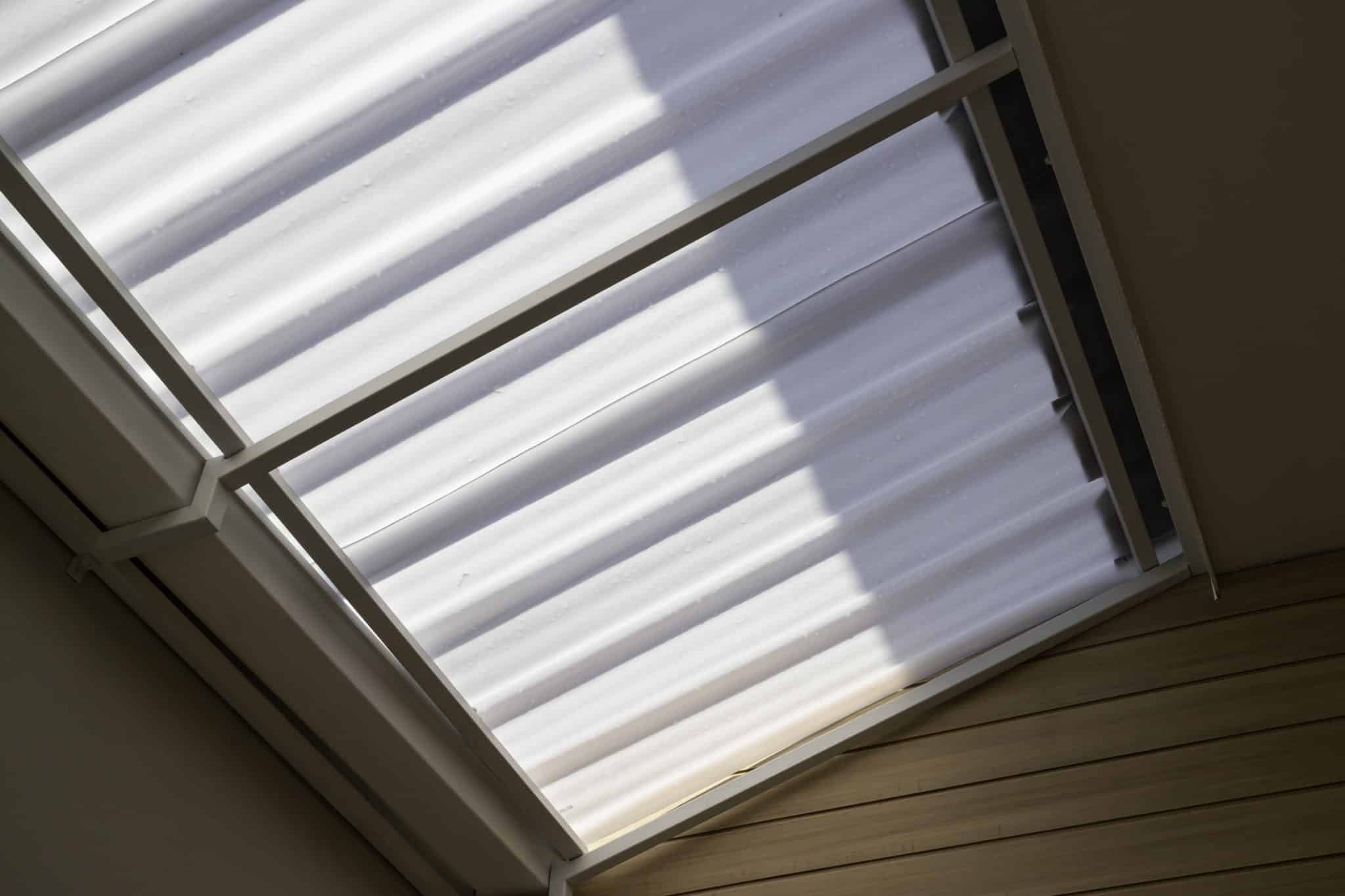 White Shutters On A Window In A Home
